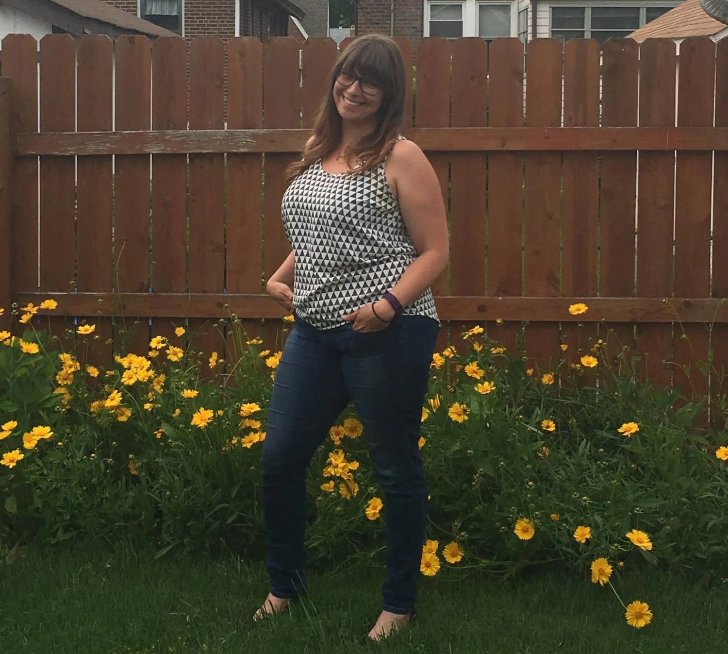 Erin Nicole Vehige, founder of ContentENV, standing in a garden